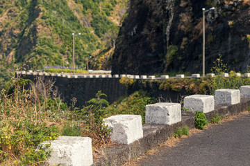 Fototapeta na wymiar A picturesque winding road in the mountains of Madeira Island, Portugal.