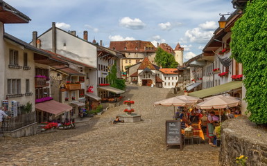 Main street in Gruyere village in Fribourg canton by beautiful day, Switzerland - 343607585