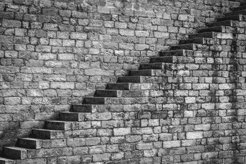 Black and white diagonal stone staircase going up