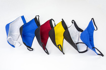 Six colored medical masks on a white background horizontally