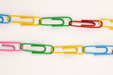 Two links of paper clips.