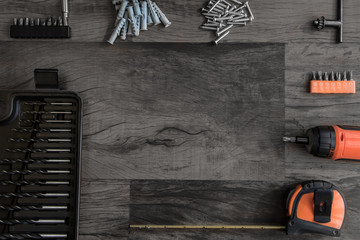 wooden background with work tools and space for copy