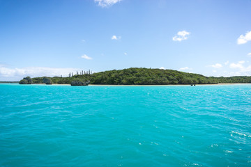 seascape of famous Upi bay, new caledonia: turquoise lagoon, typical rocks, blue sky