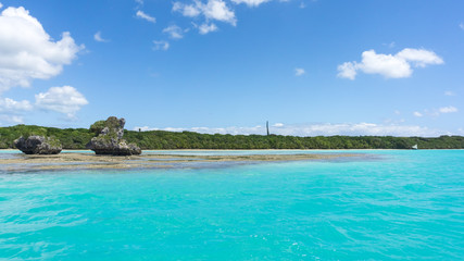 seascape of famous Upi bay, new caledonia: turquoise lagoon, typical rocks, blue sky