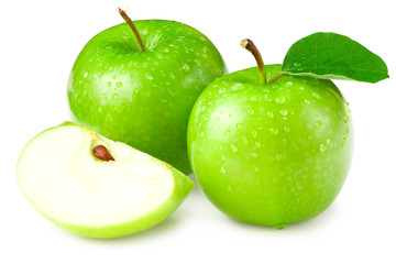green apples with slices and green leaves isolated on white background