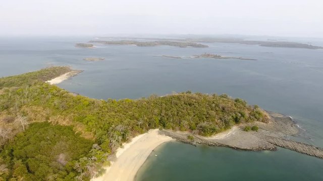 Hover to Panning Aerial Flight of Casaya Island (Las Perlas) Rocky Beach Shoreline to Fall Colored Foliage and Distant Island Beaches