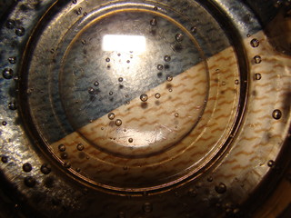 Sparkling water in a cup. Bulbs, top view. Background.