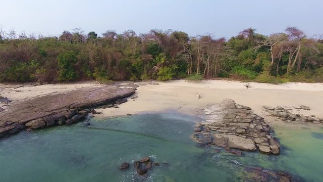 Hover to Vertical Aerial Flight of Casaya Island (Las Perlas) Rocky Beach Shoreline to Fall Colored Foliage and Distant Island Beaches