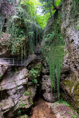 Non Valley, Trentino, Italy - 31 august 2019 - A pedestrian walkway through the Rio Sass canyon