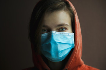 Portrait of woman wearing medical mask. Protection from catching disease. Pandemic of coronavirus concept.
