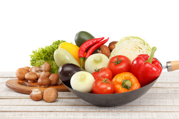 Set of fresh seasonal vegetables close-up on a white background.