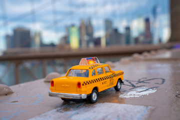 Classical yellow taxi model on an empty Brooklyn Bridge during lockdown in New York, because of the...