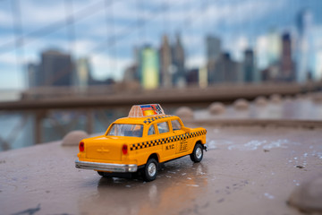 Classical yellow taxi model on an empty Brooklyn Bridge during lockdown in New York, because of the...