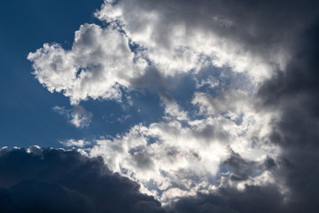 Scenic cloudy blue sky. Sunlight in high large dramatic cloudscape moody background