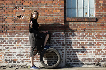 Fototapeta na wymiar girl with a tire