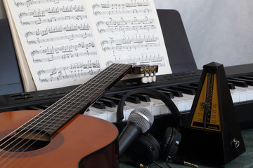 guitar, microphone, piano and sheet music