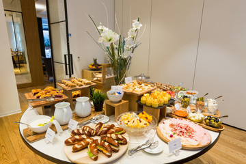 Breakfast served on buffet table in hotel restaurant