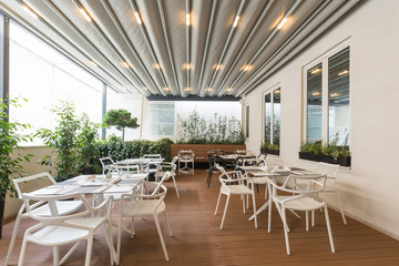 Beautiful restaurant summer terrace interior with moving roof