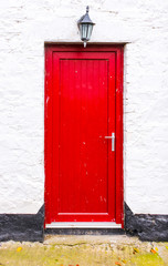 Old red door. Irish style farmhouse door.