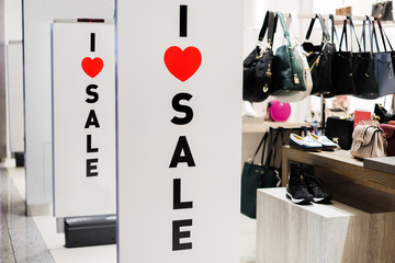 I Love Sale sign in department store. the inscription in the clothing store "i love sales"