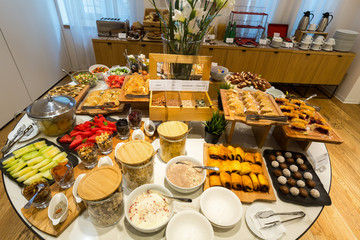 Breakfast served on buffet table in hotel restaurant