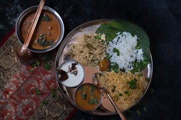 South Indian vegetarian  dishes served on platter with banana leaf