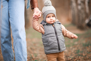 Mom and son walking in a park