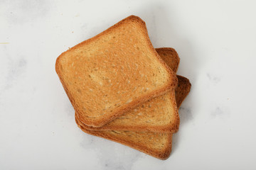 Toast biscuits over white background crunchy food