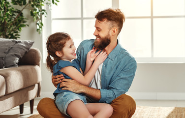 Father and daughter having fun at home.