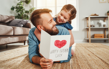 Little girl congratulating dad with Fathers day.