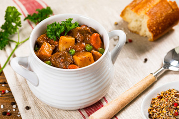Beef Stew with Potatoes and Carrots made in a Slow Cooker. Selective focus.