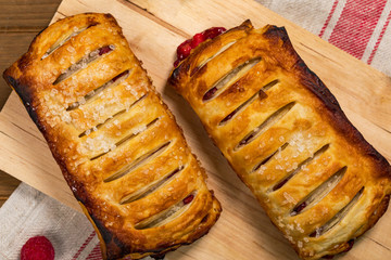 Puff Pastry Fruit Berry Strudel on Wooden Background. Selective focus.