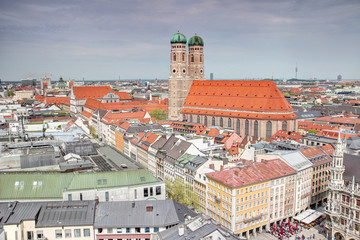 Elevated view of Gothic Frauenkirche cathedral, landmark building of the city,  rising high above the roofs of old town / historic center Altstadt near Marienplatz square Munchen Bayern Germany Europe