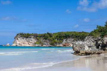 Fototapeta na wymiar Beach landscape with rocks, white sand and trees, Macao beach, Dominican republic 