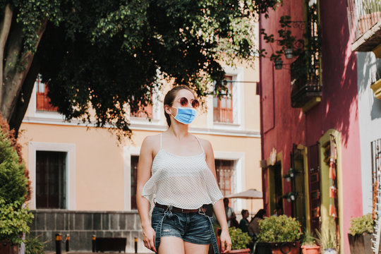 Latin Woman wearing hygienic mask to prevent infection or respiratory illness such as flu. Mexican girl with Protection against contagious disease, coronavirus in Mexico Latin America