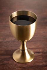 Wine for Holy Communion or the Lords Supper Prepared on a Dark Wood Table