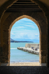 Fototapeta na wymiar arch on the buildings overlooking the port of Cefalu north of Sicily