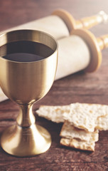 Communion or the Lords Supper Prepared on a Dark Wood Table with an Antique Scroll