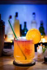 
drinks on a bar counter with fresh and natural orange and lemon