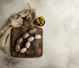 spanish food - sausages on the cutting board - butifarra blanca and morcilla de cebolla