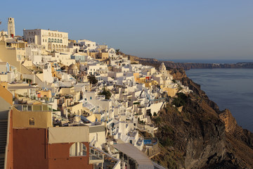 The town of Fira, on the island of Santorini, Greece, is shown in an early evening view, during...