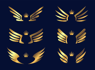 Set of six pairs of gold wings with crowns. Vector illustration.