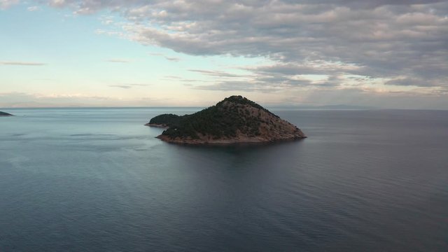 Drone flight around the coastline of Thasos island and the little island Nisida Kinira, Greece