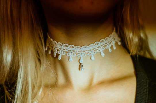 Midsection Of Woman Wearing Choker