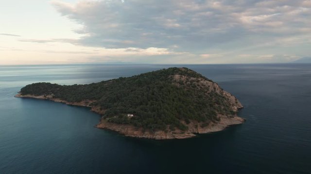 Drone flight around the coastline of Thasos island and the little island Nisida Kinira, Greece