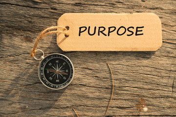 Magnetic compass and paper tag with words 