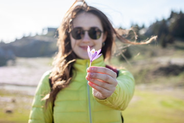 young beautiful woman walking outside windy day