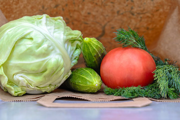 Vegetables in a paper bag close-up with a copy space. Eco-vegetarian diet products.