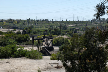 Oil pump jack working in an oil field