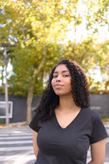 Black woman on urban background in casual clothing